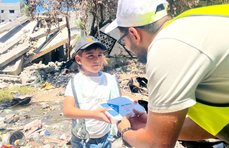 Human appeal staff gifting something to a kid